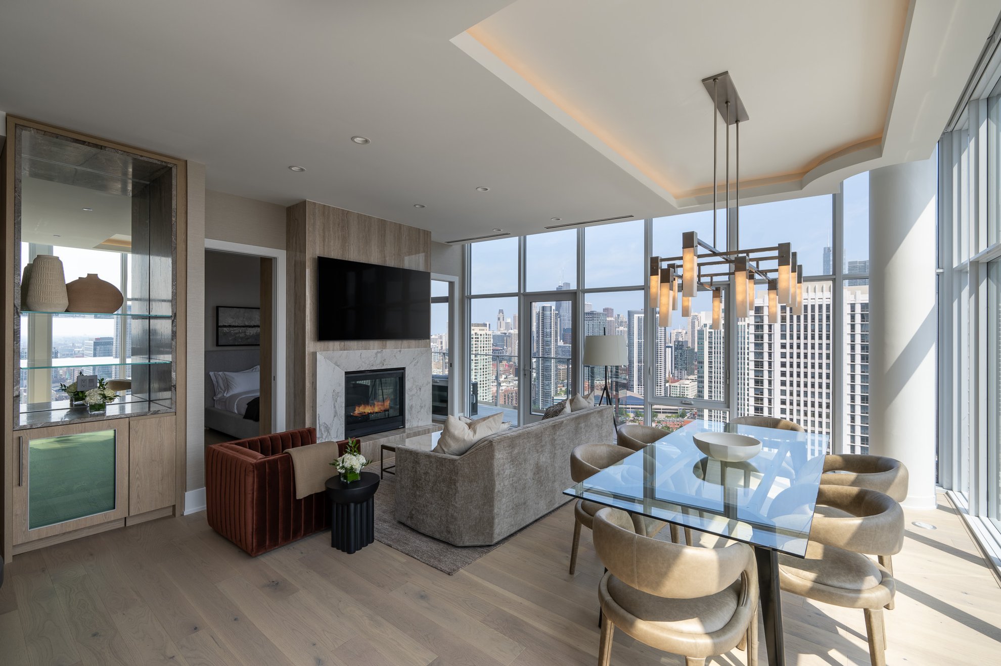 living area at the penthouse level chicago fulton market with big window with chicago skyline