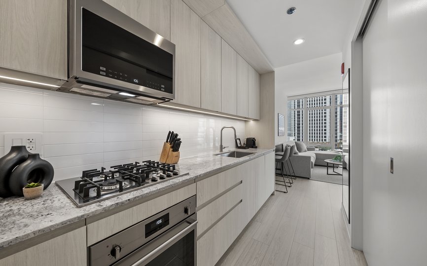 kitchen area features modern appliances of junior two beedroom suite at level chicago fulton market