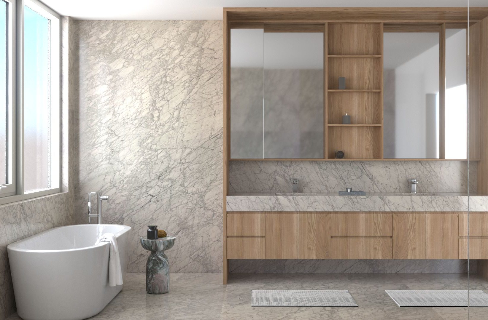 Modern bathroom with marble walls and floor, a freestanding bathtub near a window, a small round side table, and a double sink vanity with wood shelves and cabinets. Two bathmats are placed on the floor.