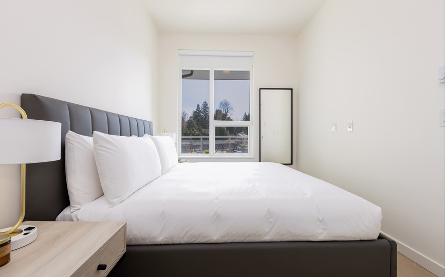 modern bedroom in one bedroom furnished apartment in port moody vancouver