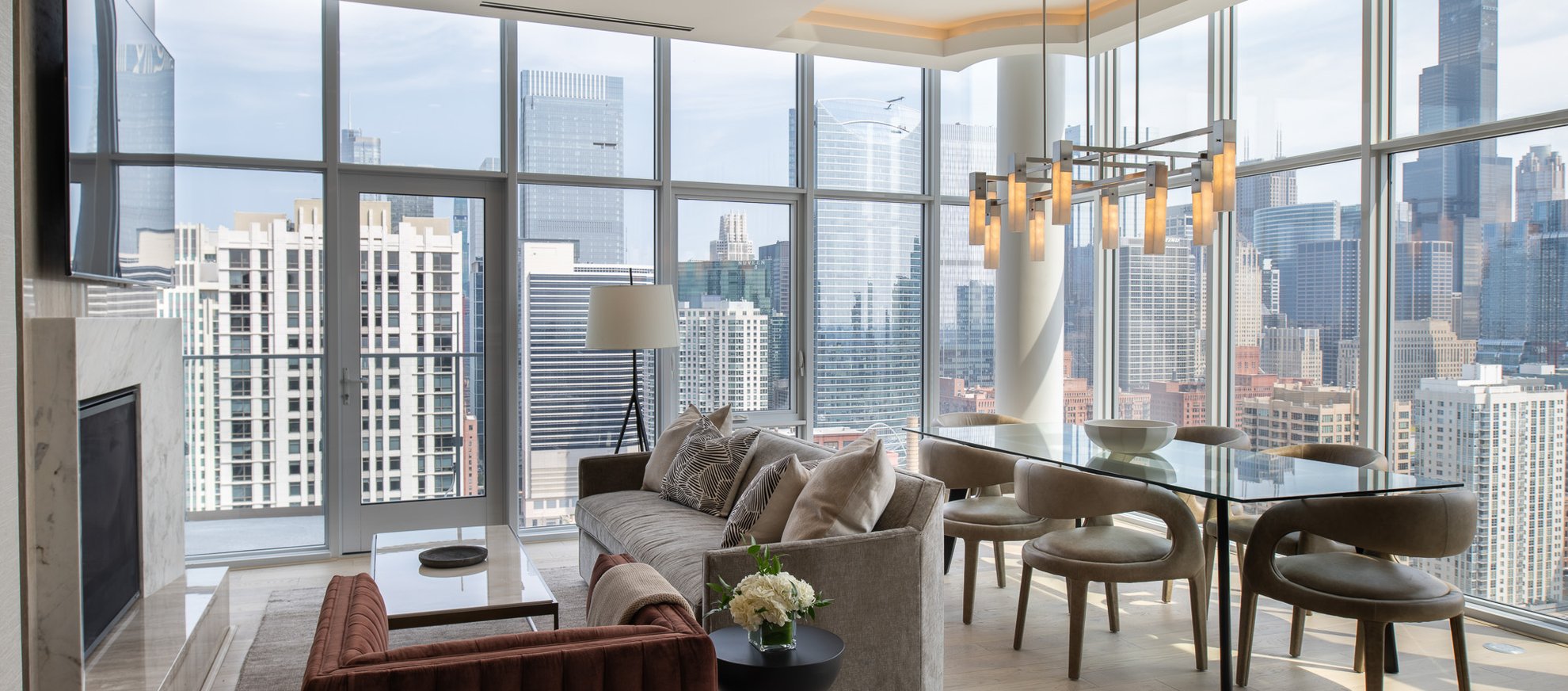 living area with the city of chicago skyline at the penthouse level chicago fulton market