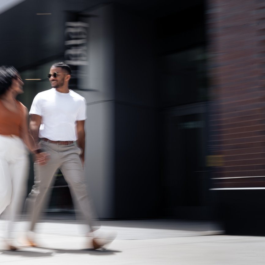 man and women walking outside