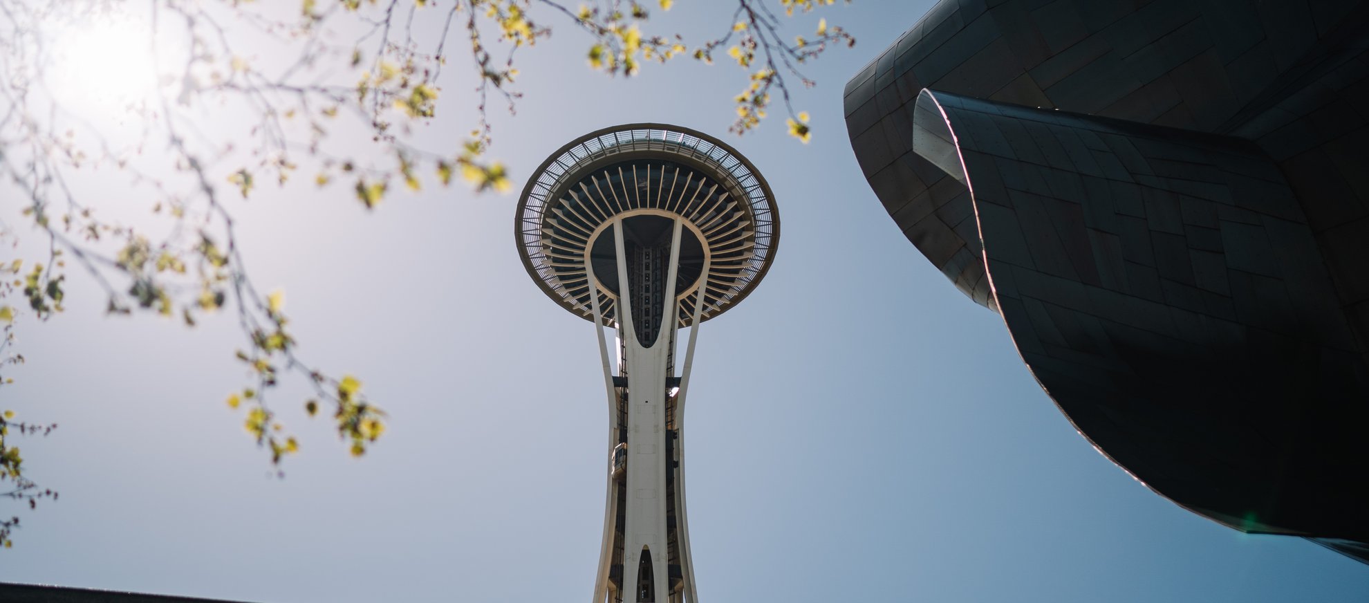 View of the Space Needle from the ground presented by Visit Seattle