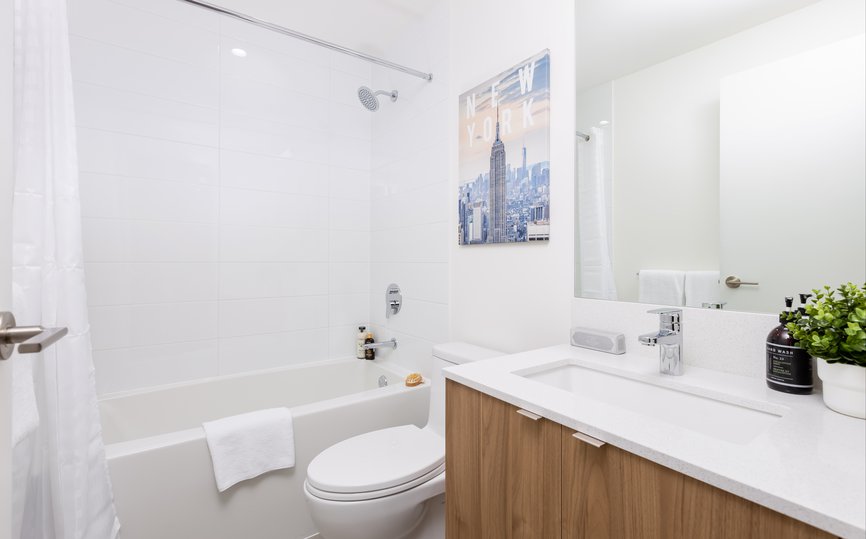 modern bathroom with bath tub at level port moody in two bedroom furnished apartment