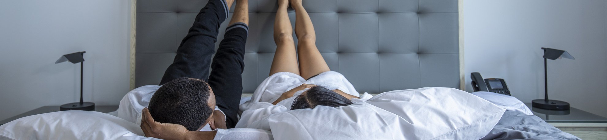 Guests relaxing in bed