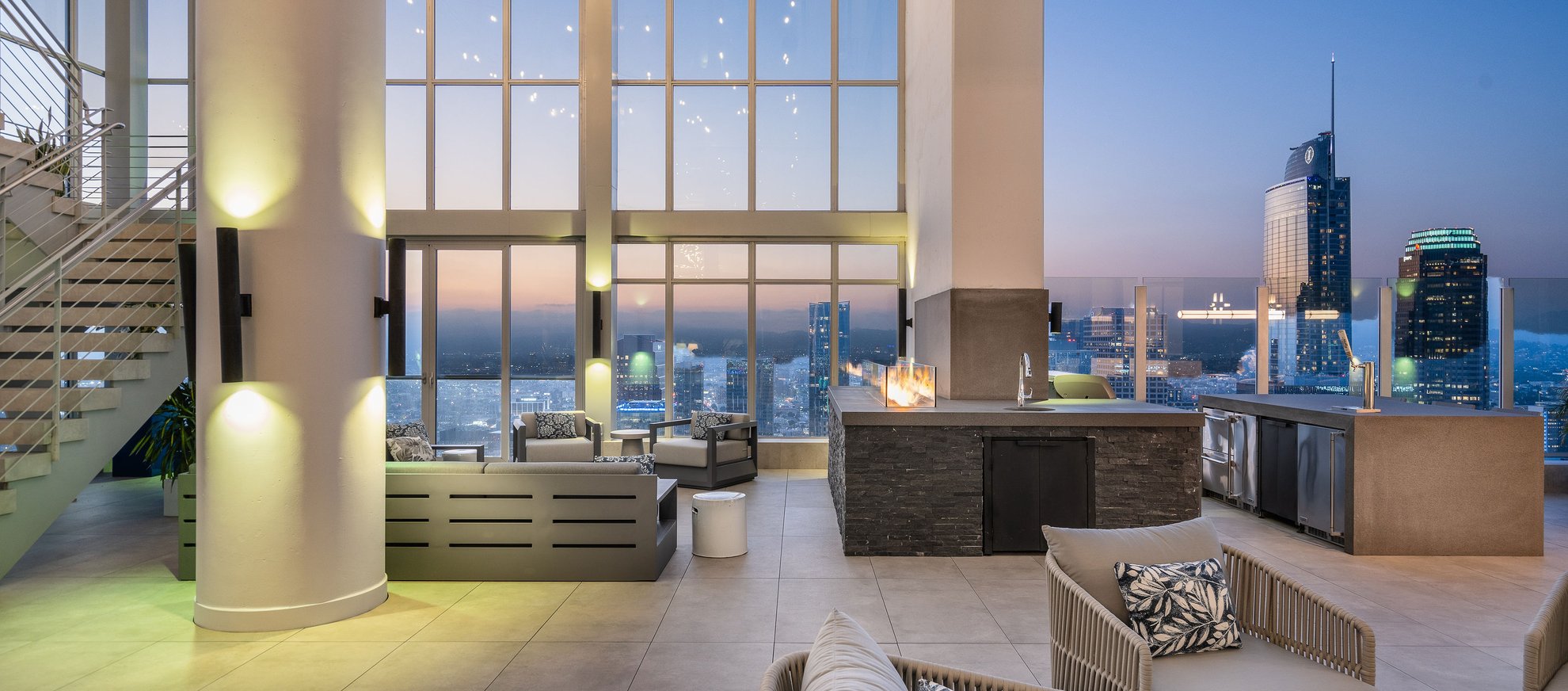 the penthouse at level south hill featuring outdoor space with outdoor furnitures and beautiful city view