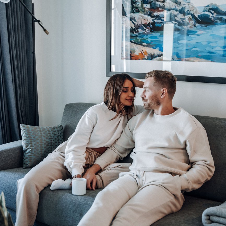 couple sitting in the living room at level vancouver howe