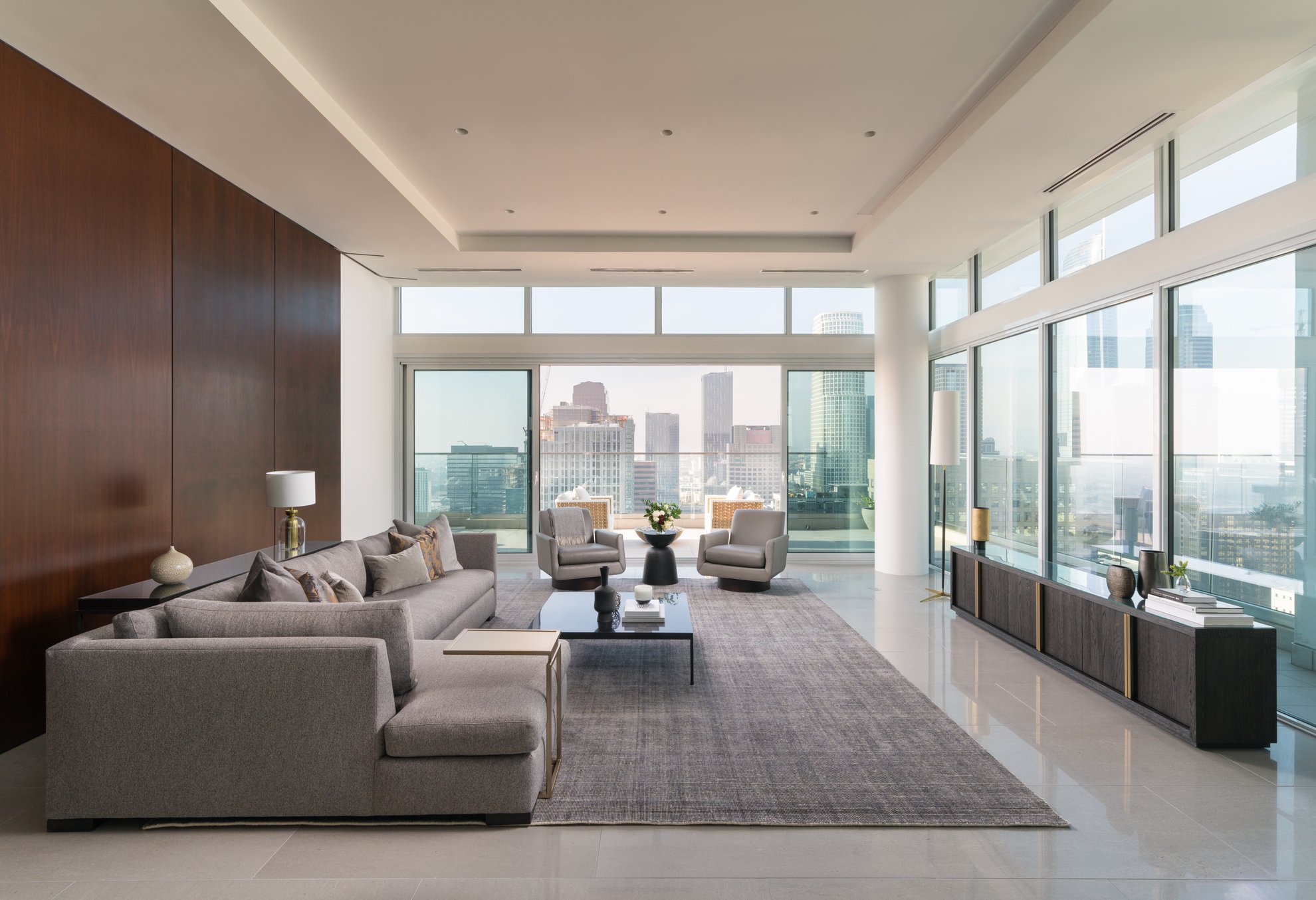 level south olive penthouse featuring spacious living room, open concept and dtla city view from balcony