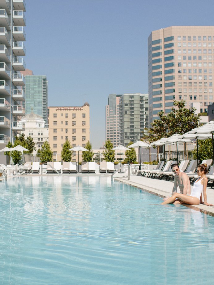 couple enjoying the pool at level los angeles downtown south olive
