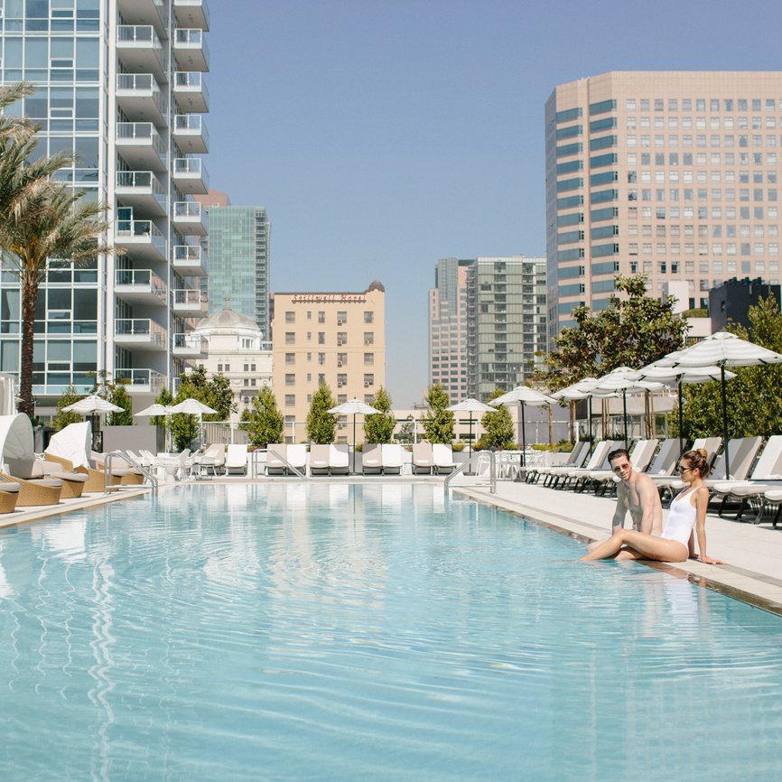 couple enjoying the pool at level los angeles downtown south olive
