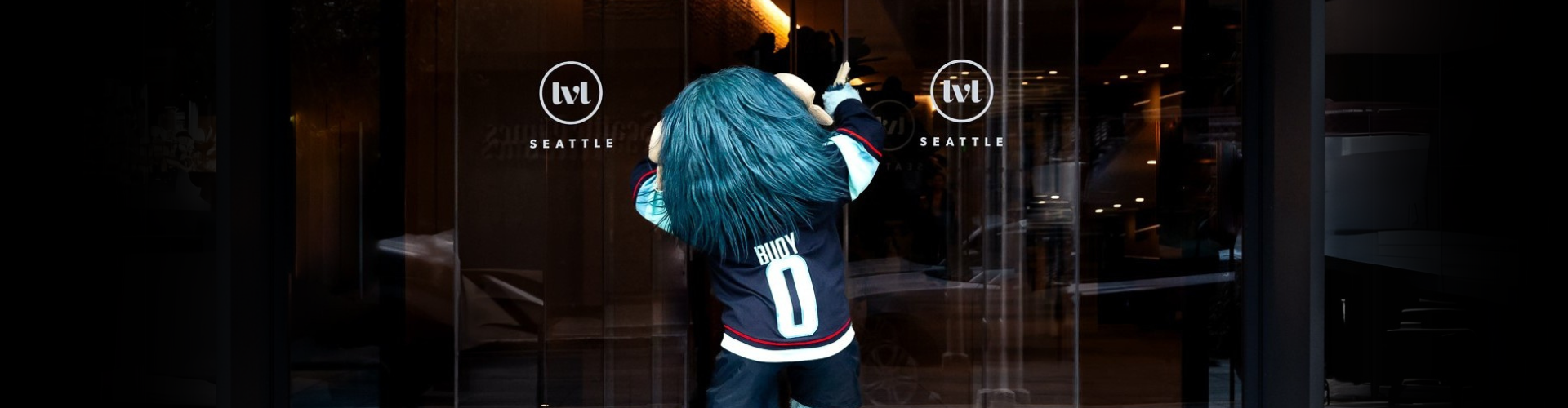 kraken mascot buoy entering the front entrance of level seattle south lake union