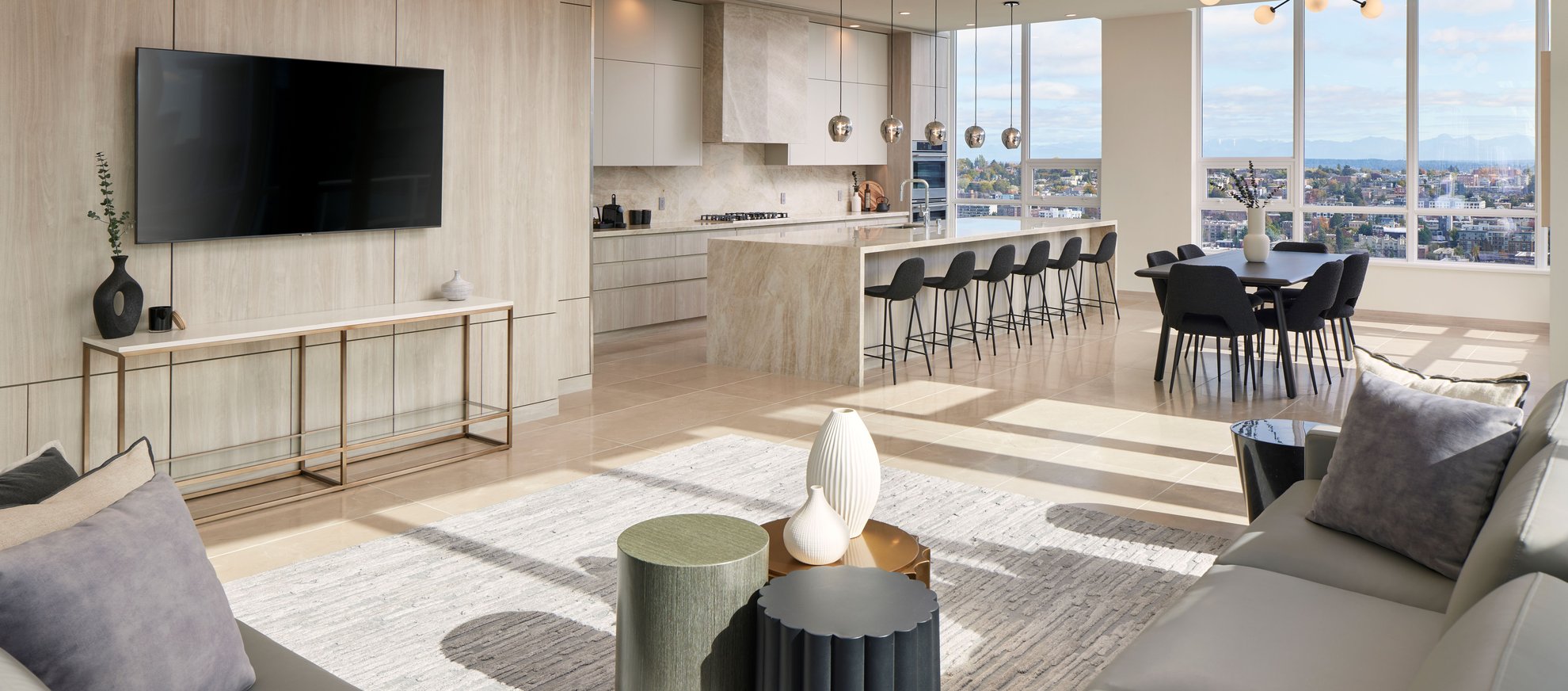 contemporarily designed suite with living, dining, and kitchen areas at the penthouse at level seattle south lake union.jpg