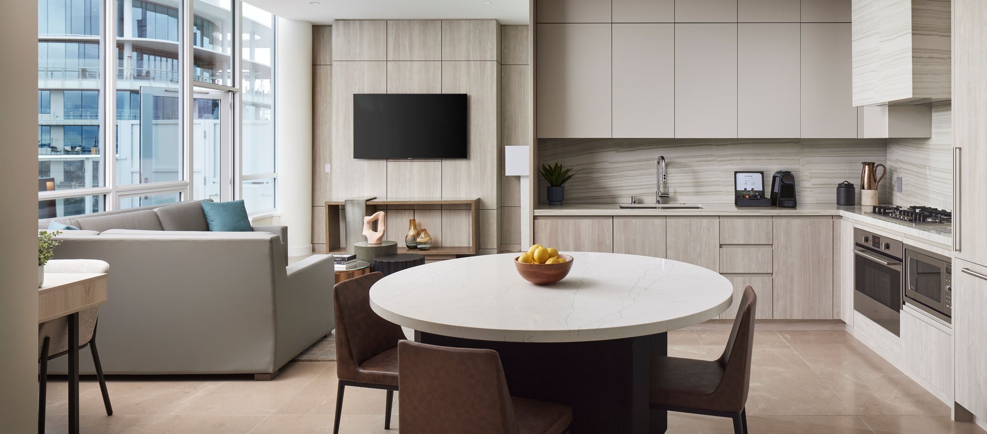 contemporary penthouse living area and kitchen with sleek design and ample seating at Level Seattle south lake union.jpg