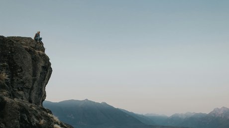 Person sitting on Rattlesnake Ledge in Pacific Northwest