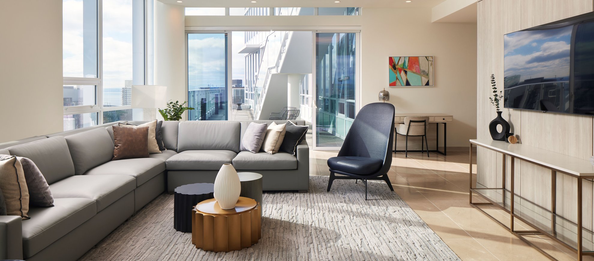 modern living room features l shaped sofa, tv wall mounted, high ceilings at level seattle south lake union the penthouse.jpg