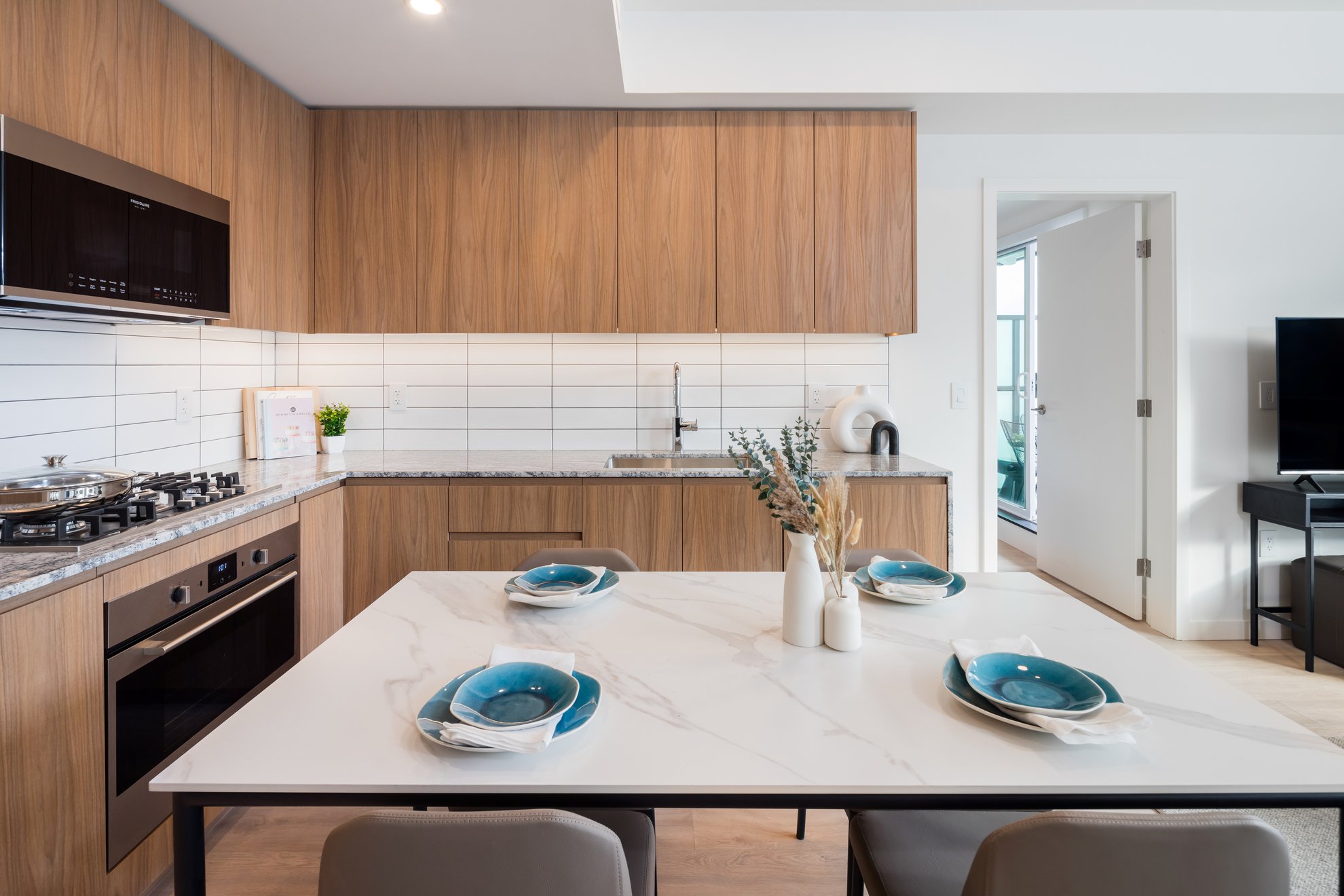 modern fully equipped kitchen and dining area in furnished two bedroom aparment for rent in richmond